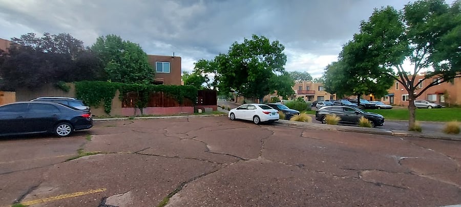 Shared parking area, fields, playground, basketball courts, and skate park across the street.