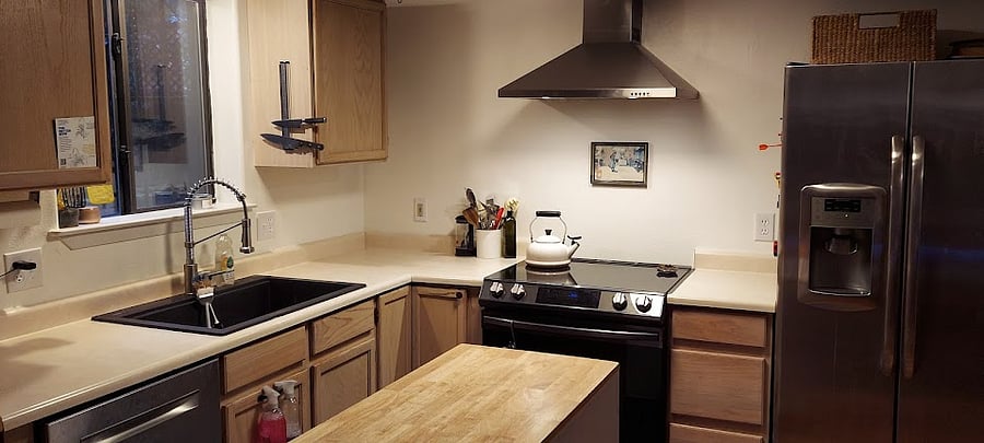Dishwasher, sink, faucet, range hood, induction range, and refrigerator are all new.