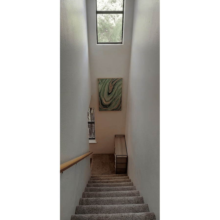 Stairs immediately to your left when you enter the house lead up to the bedrooms and full bath.