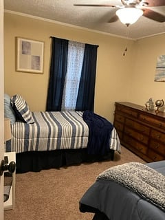 Bedroom 1 features twin beds with television