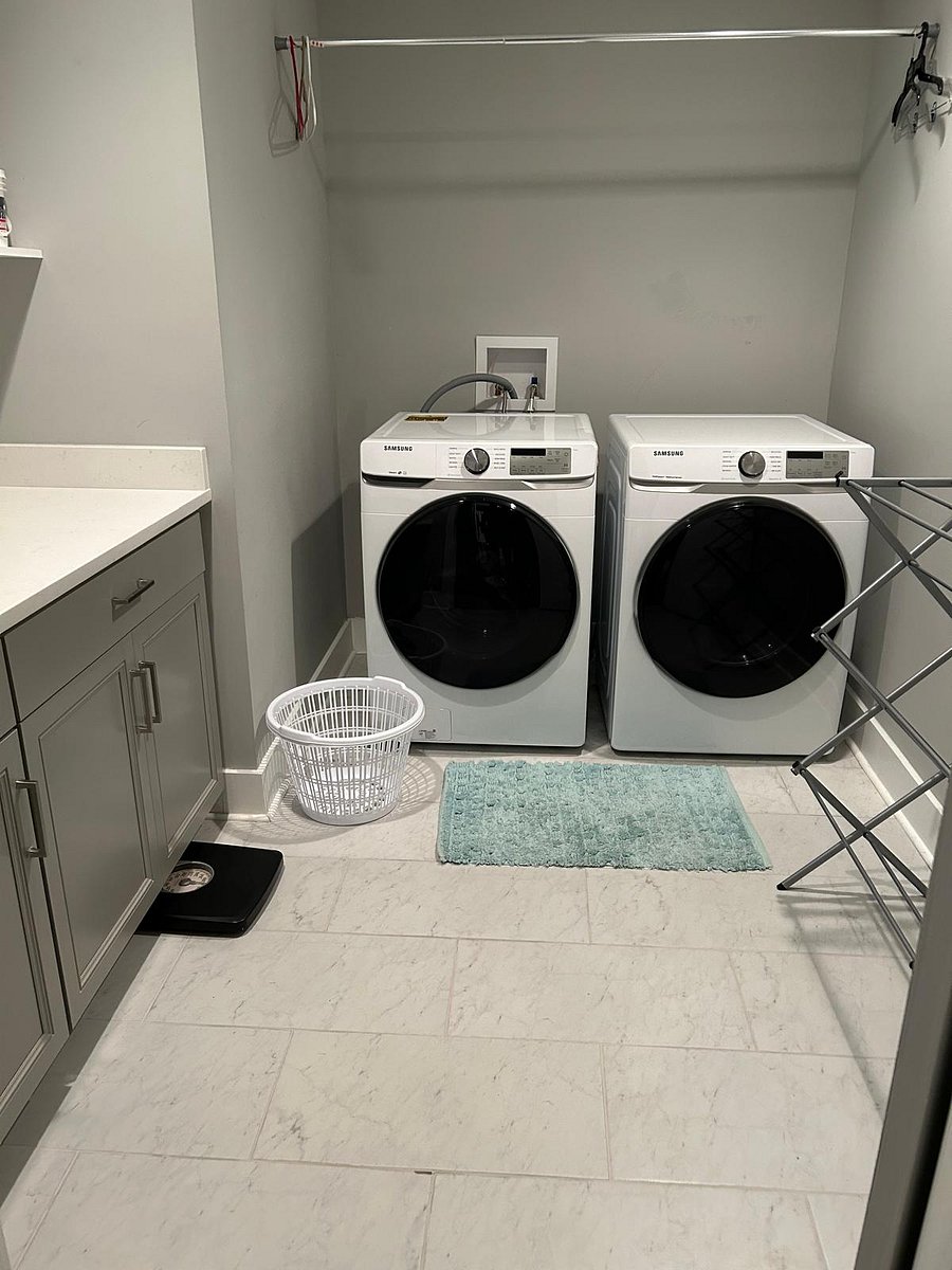 The laundry room has lots of space to fold and iron or air dry. Comes with a new washer and dryer.