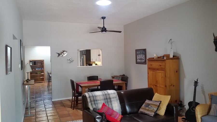 Living area transition to dining. Peek a boo to kitchen.