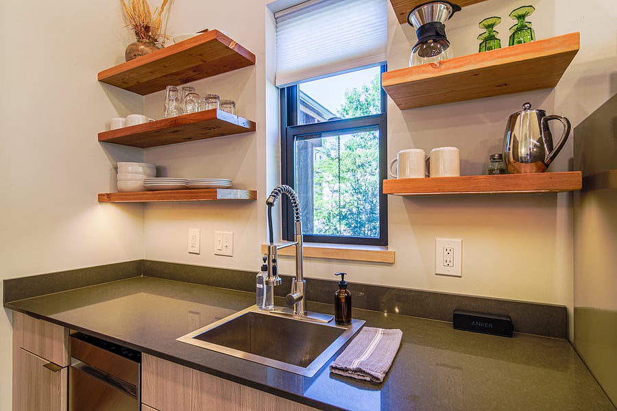 Kitchenette has a dishwasher, refridgerator/freezer, food disposal, double burner hot plate, crock pot, blender, multiple coffee making options, cutting boards, mixing bowls, and multiple utensils for making food.
