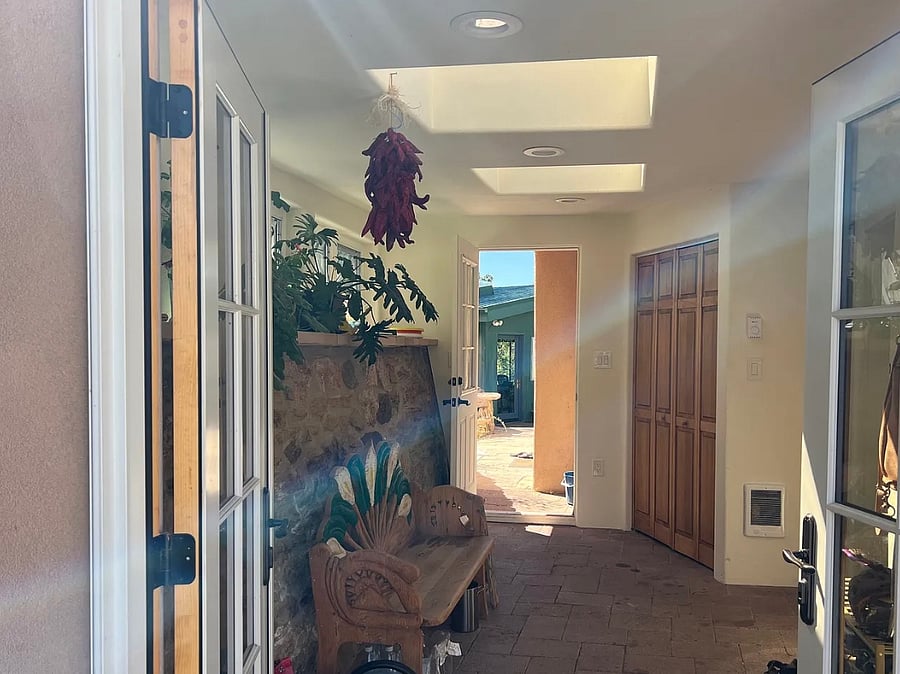 Sunroom-Entry from upper driveway, kitchen door on right, small office/studio and hot tub out back