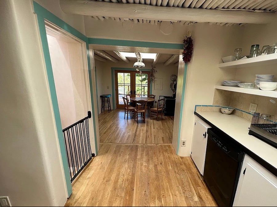 Kitchen from upper driveway/Sunroom entrance, looking out at dining room/ front view deck