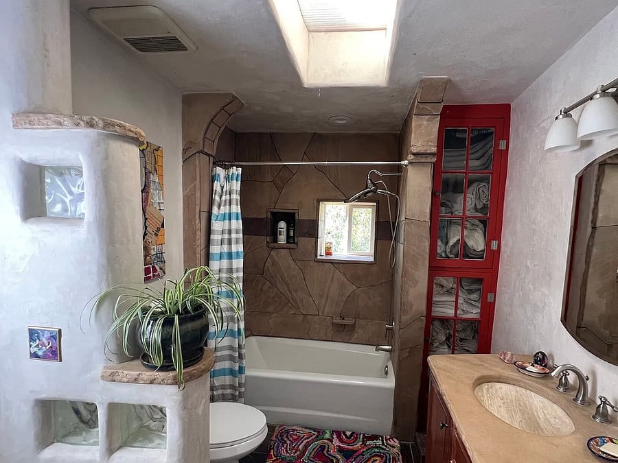 Guest bathroom (connected by door to 2nd bedroom to the right, laundry behind you, outside door to back patio/hot tub to your left) 