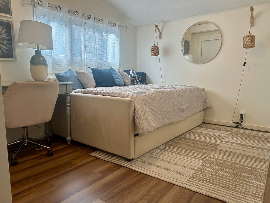 Second bedroom that features a full daybed, twin trundle, and desk.