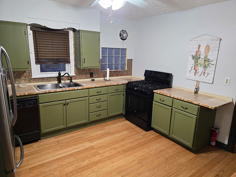 Fully Equipped Kitchen  Stocked with cookware, dishes, utensils, and small appliances.