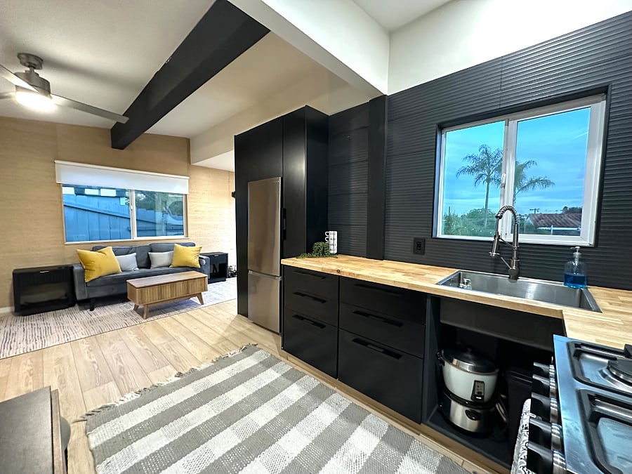 Recently renovated kitchen from top to bottom with beautifully designed modern cabinetry with pull out drawers and plenty of cabinet space.