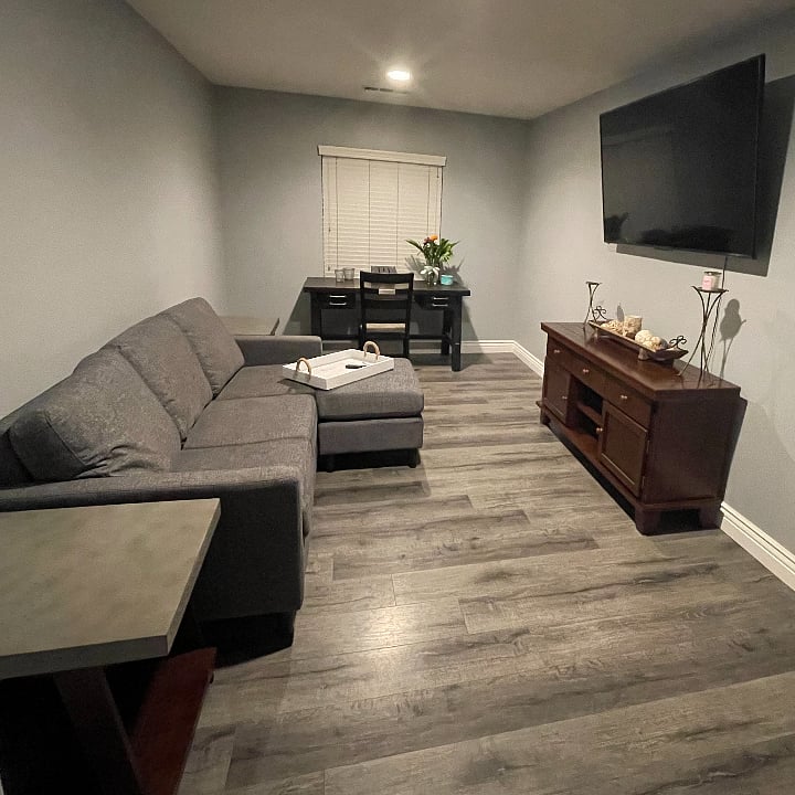 2nd private room with a TV, Couch, and office space