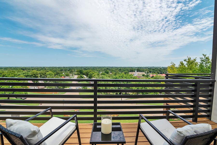 An intimate balcony off the primary suite with lush treetop viewsyour own private moment of calm above the city.