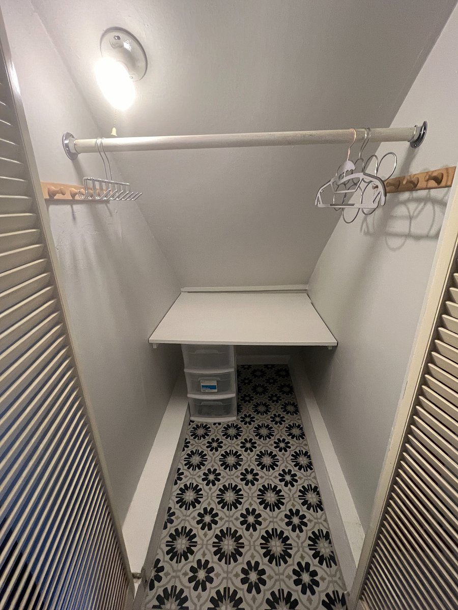 Deep closet.  Hangers are provided but not shown.
