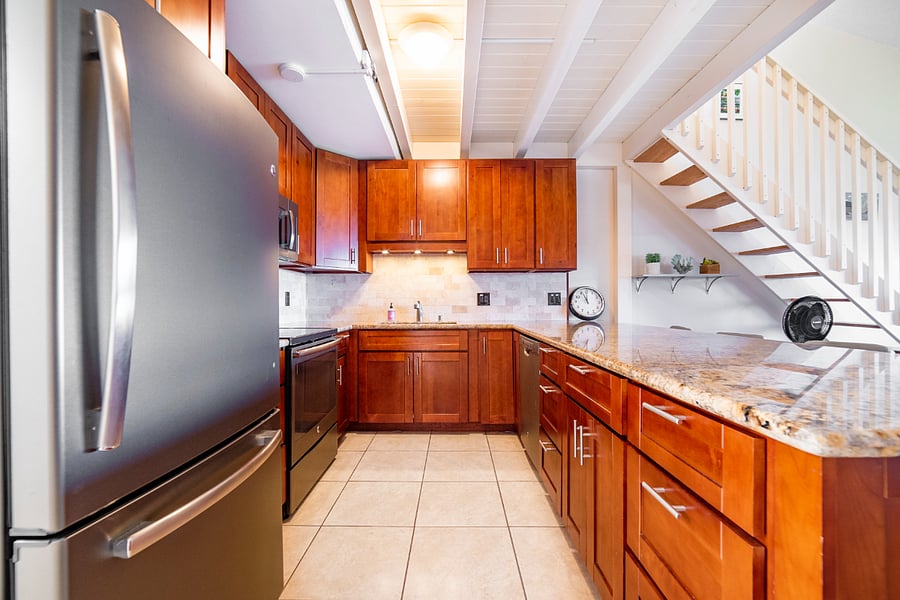 Full kitchen, stocked with pots, pans, silverware, cups, bowls, etc.