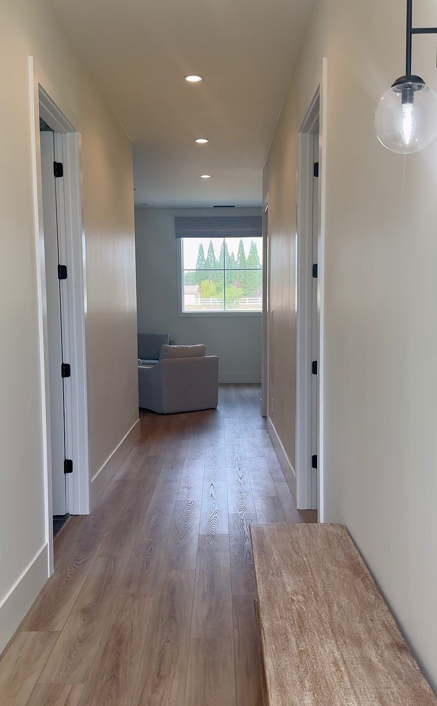hallway off entry / to the left is the laundry room and bathroom / to the right is a spacious storage closet/room and dedicated office with daybed to serve as second bedroom (photos of laundry, storage, and 2nd bedroom coming very soon)