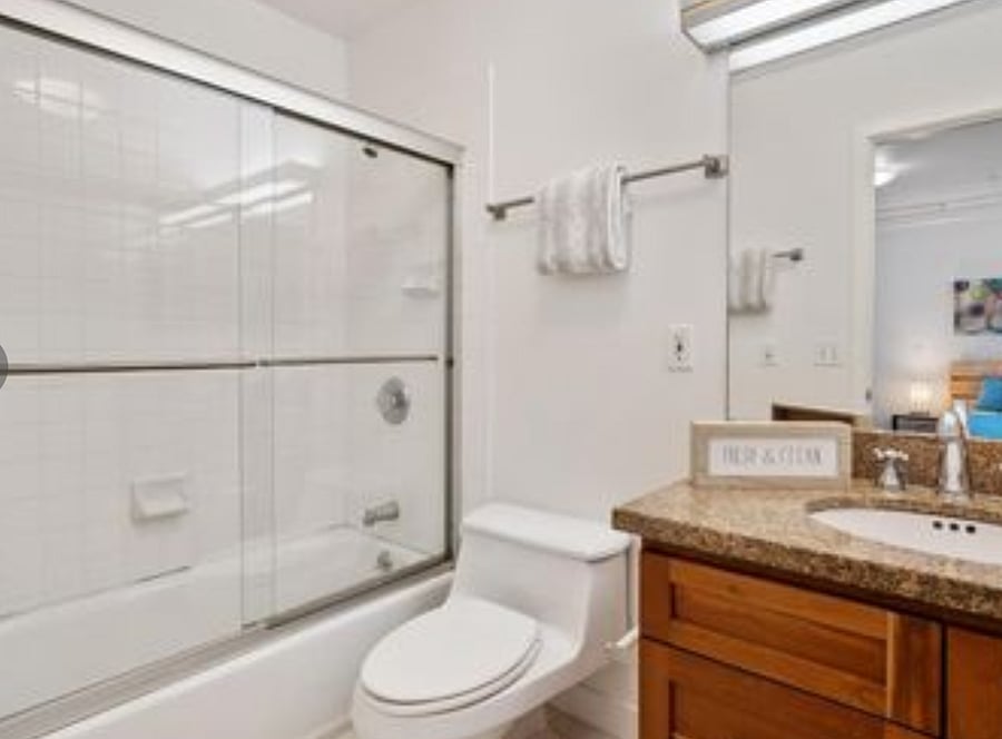 Shower over Tub Bathroom with Granite/Cherry Cabinetry