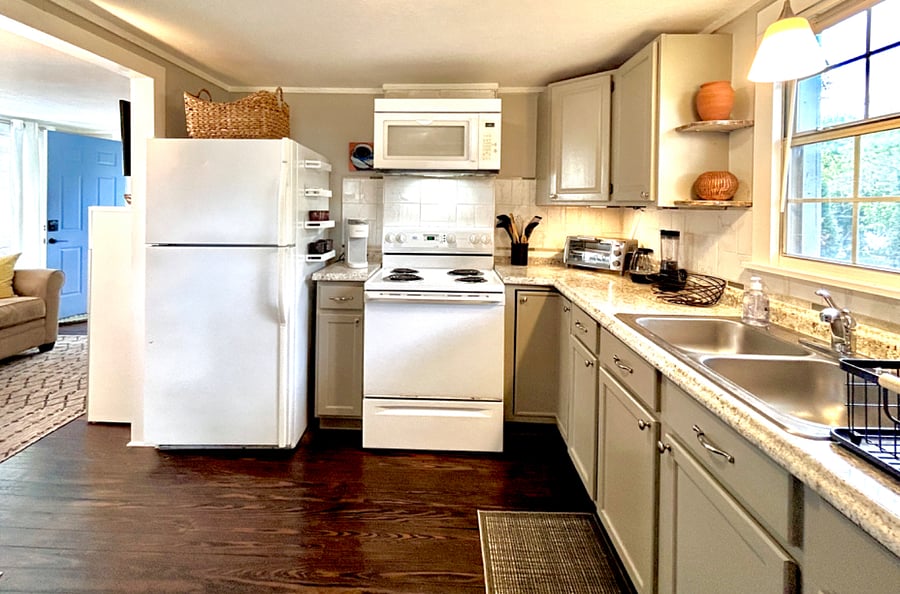 Spacious fully equipped kitchen with original hardwood floors