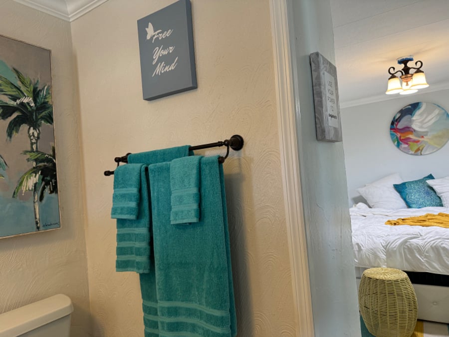 LARGE PRIVATE BATHROOM ATTACHED TO YOUR MASTER SUITE WITH OPEN WINDOWS LEADING TO NATURE PRESERVE.. 