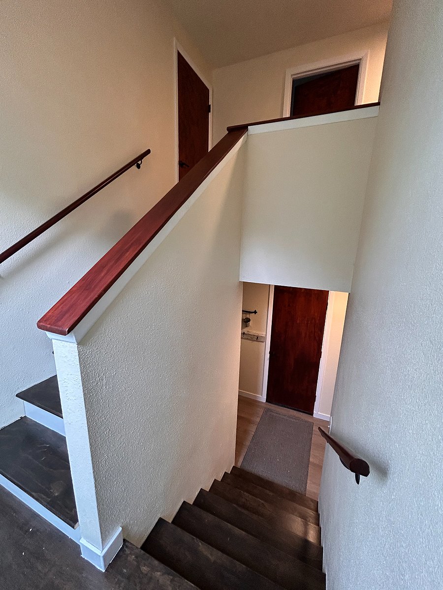 The stair landing. There's a 6'x3' window in the background letting in south west light to both levels all day long. 