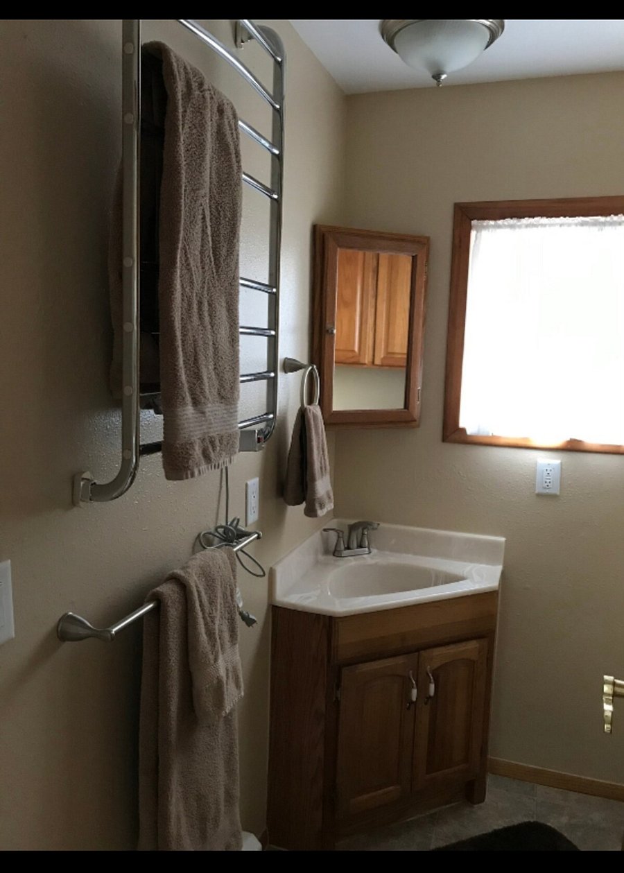 Bathroom with walk in shower. amenities to start and blow dryer