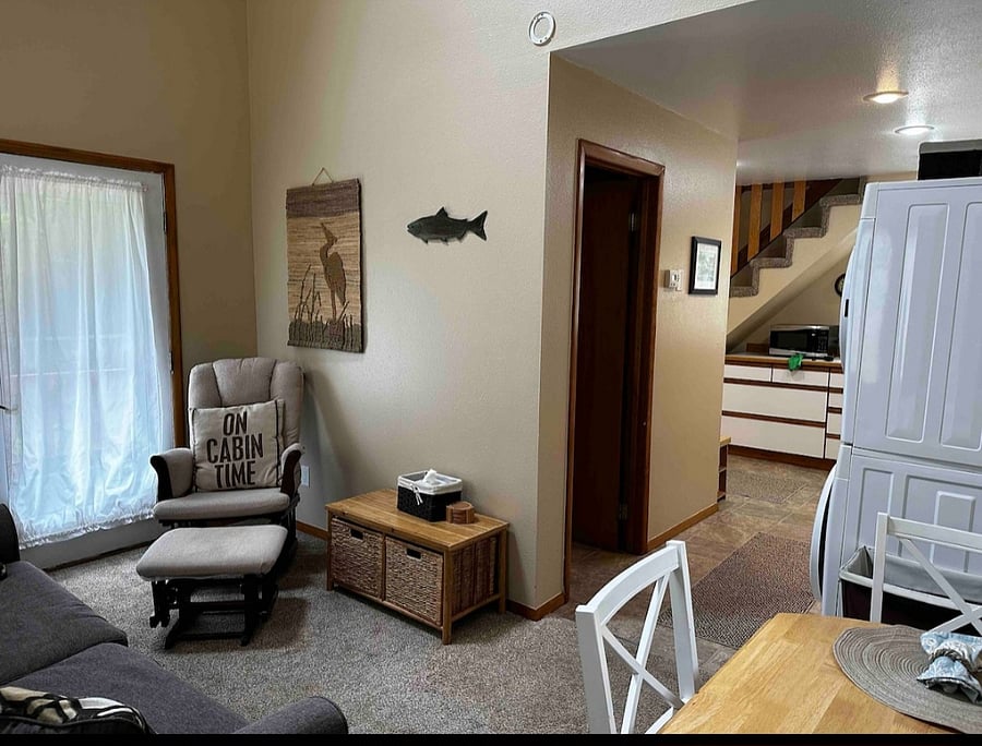 Looking from the living area and towards the kitchen, bathroom. To the right is where the stackable washer/dryer unit is located