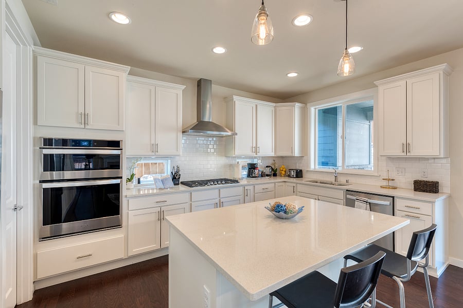 Modern Kitchen cabinets with quartz countertop. Stainless steel appliances