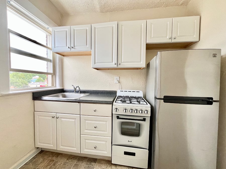 Efficient kitchen with gas stove and good amount of storage