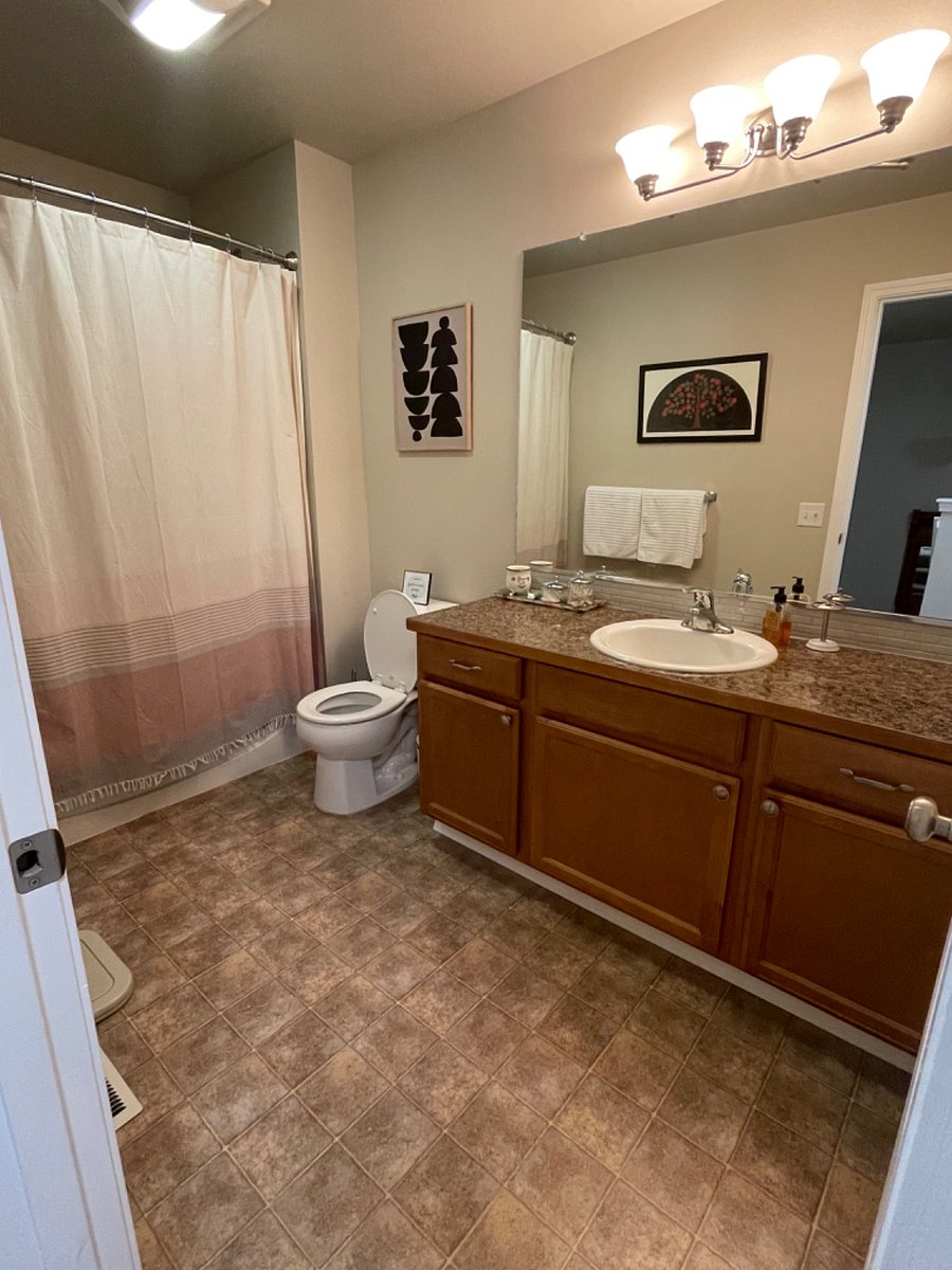 upstairs full bath. large vanity & mirror
