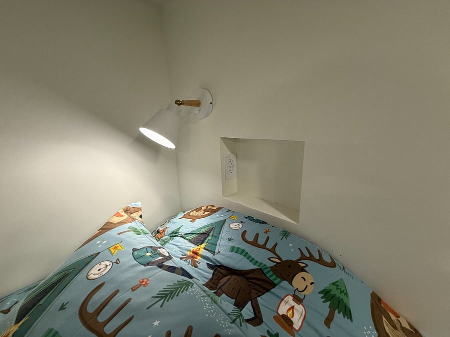 Each Twin Bed has it's own little cubbie with USB-B and USB-C charging stations