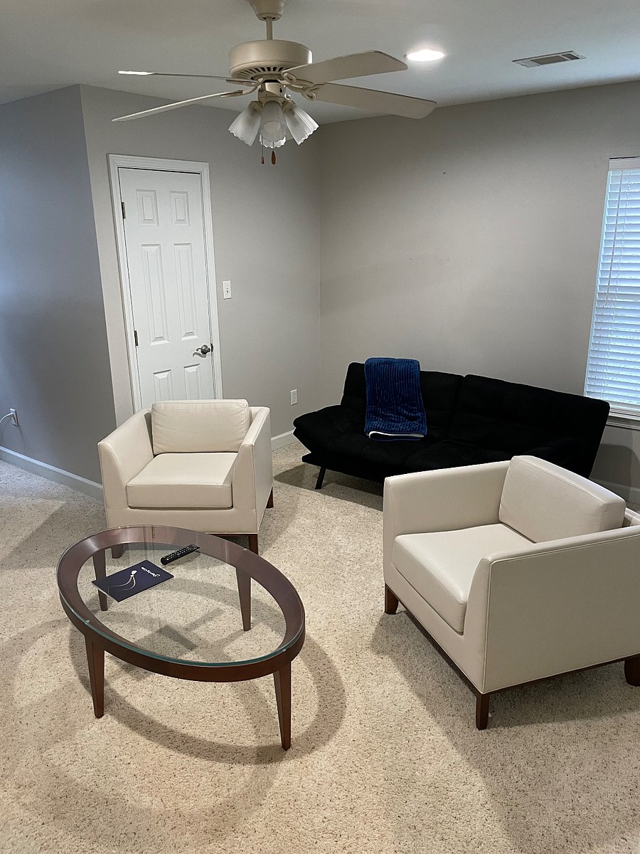 Sitting area in office with fold out futon