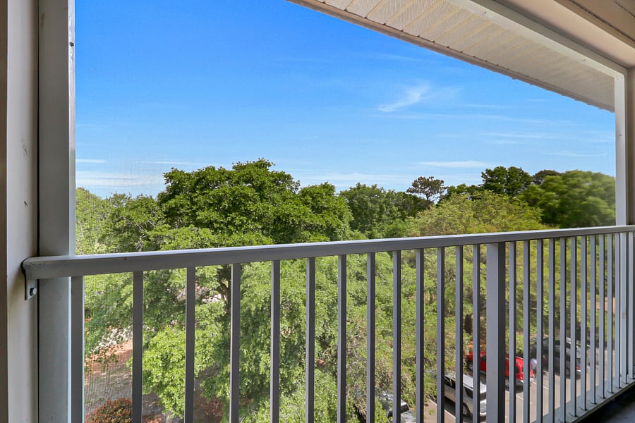 Peaceful view with table and sitting area, screened Private Balcony