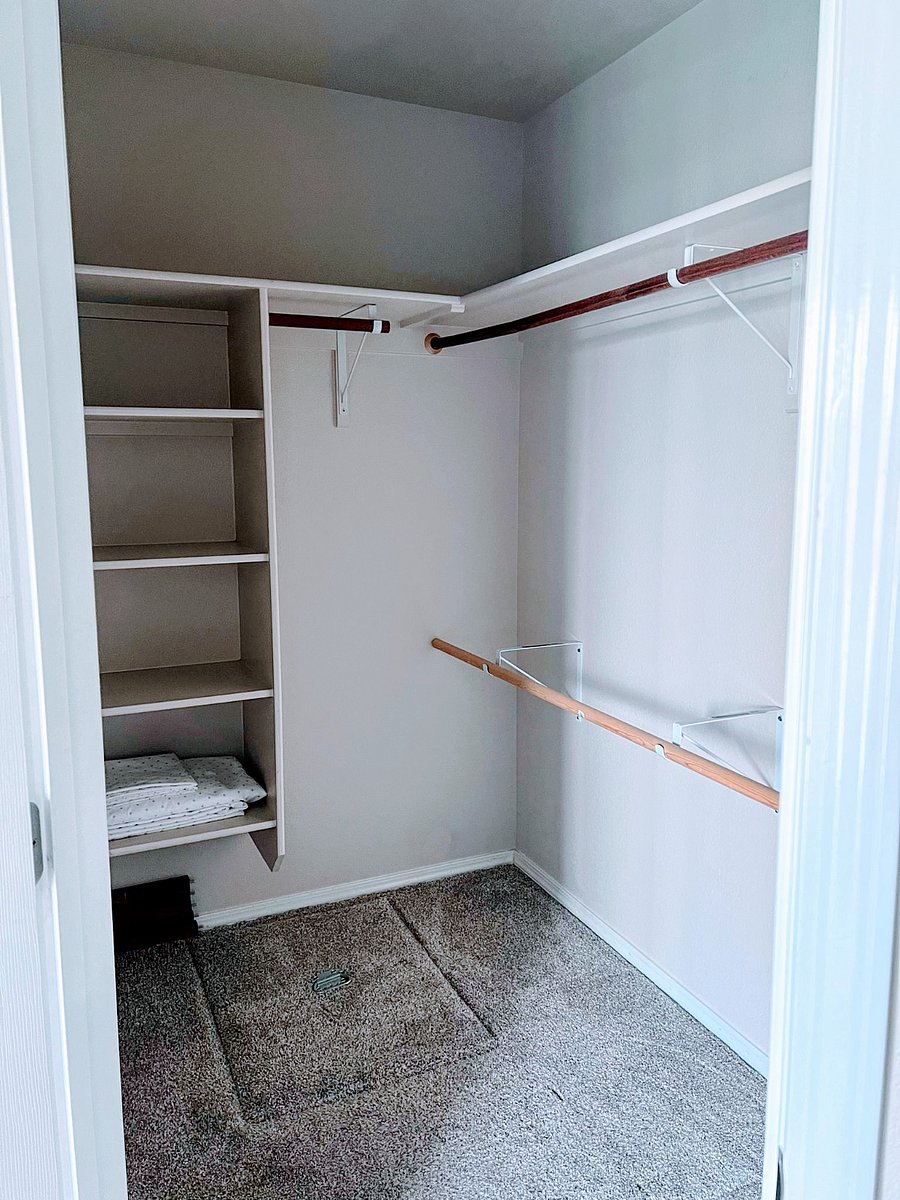 Walk in closet with plenty of space for personal items