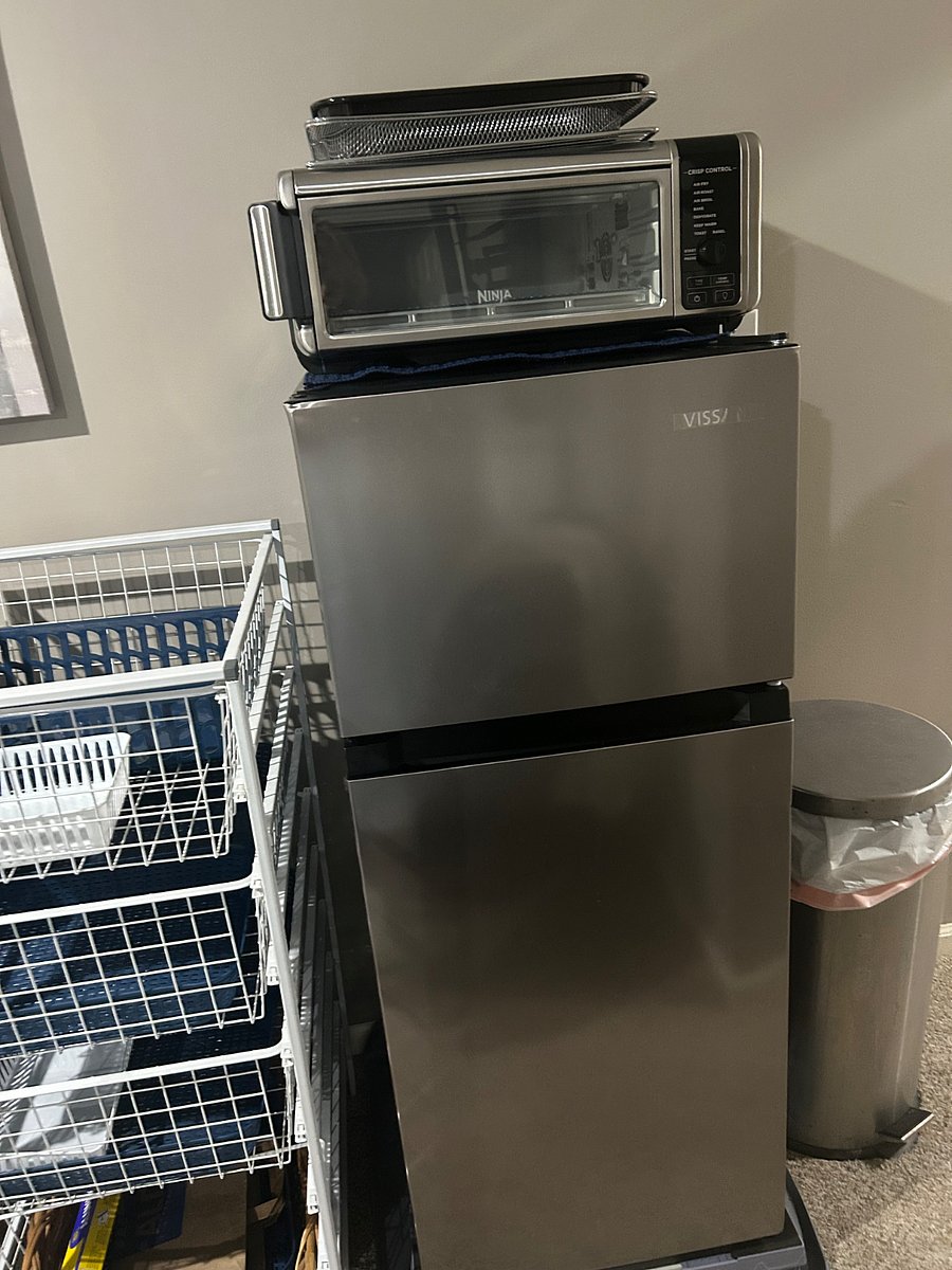 Refrigerator has been upgraded to a larger apartment size.