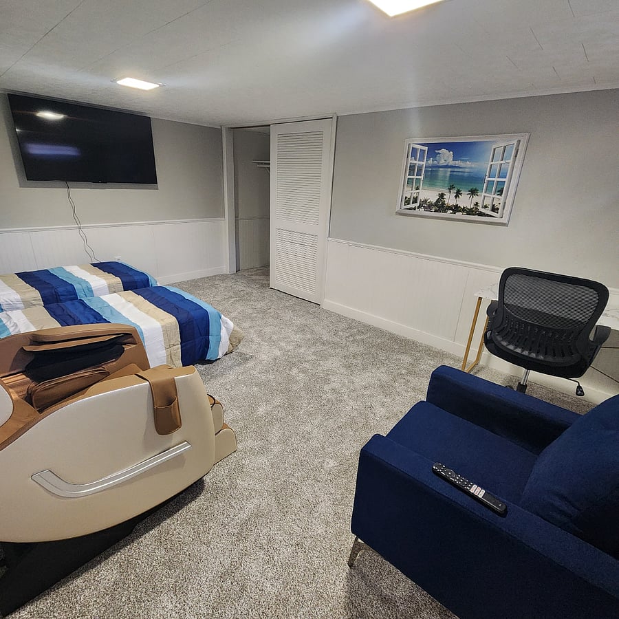 Upon request, the multi-purpose room in the basement can be set up as a third bedroom with two roll-away beds.