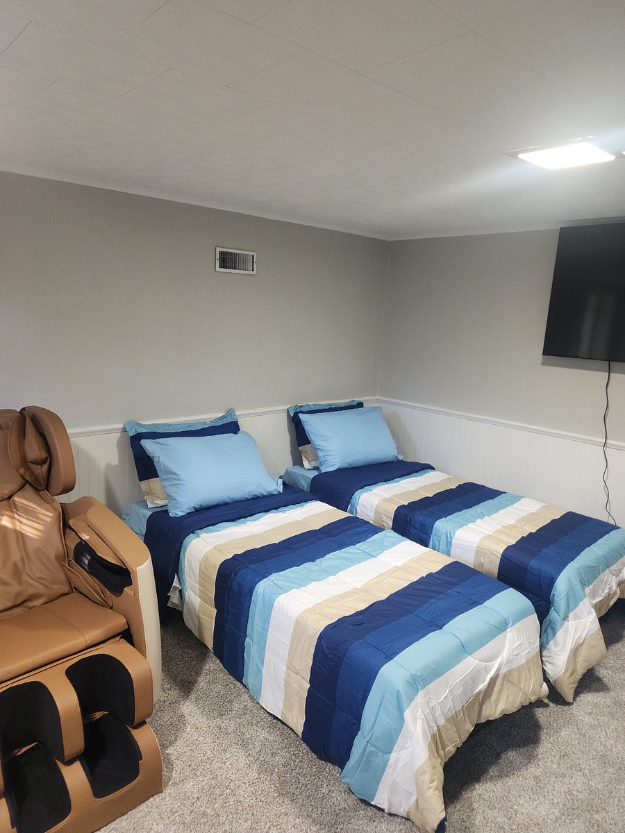 Upon request, the multi-purpose room in the basement can be set up as a third bedroom with two roll-away beds or a queen bed