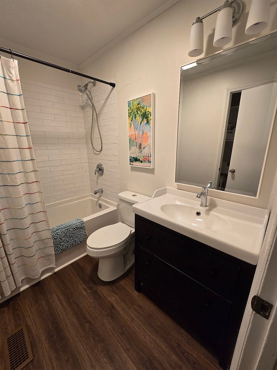 Bathroom with shower and soaker tub. Vanity with deep drawers for storage.
