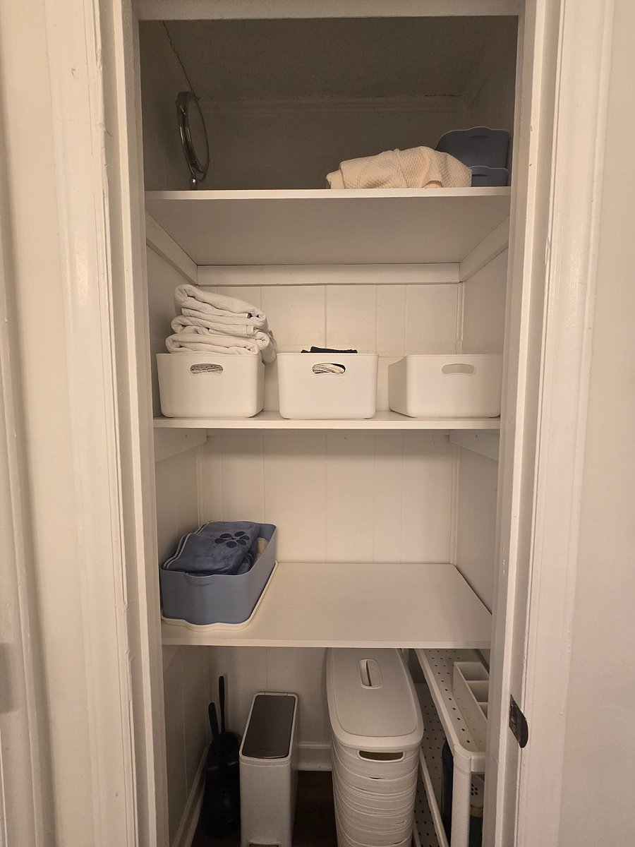Spacious storage closet in bathroom.