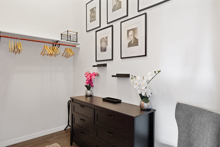 Large walk-in closet with ample hanging and storage space for long-term stays.