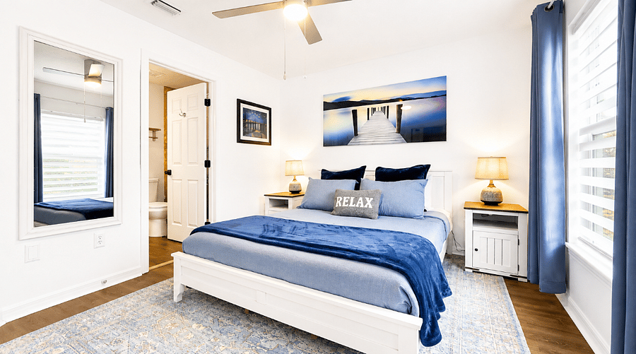 Ground-floor queen bedroom with attached semi-private full bathroom convenient for guests who prefer to avoid the upstairs bedrooms.