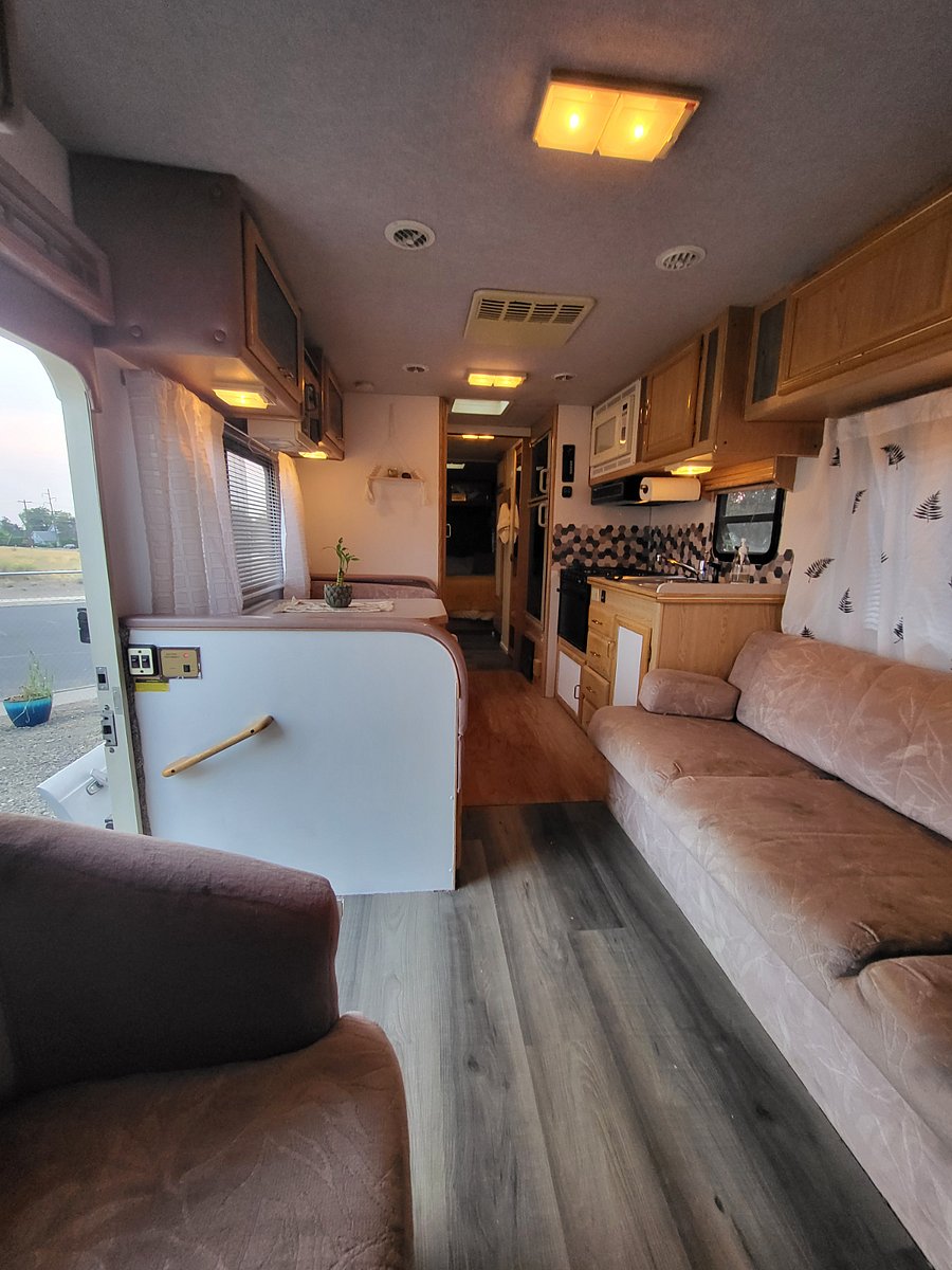 Small kitchen, eating area that can convert to another sleeping space and the couch also converts to another bed.