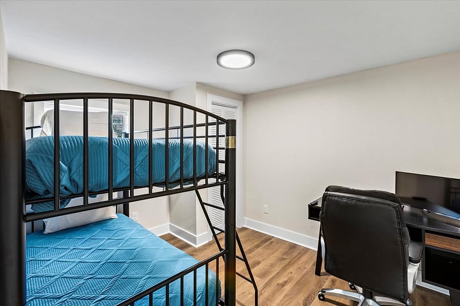 Bunk room and office area. Smart TV can be used as an additional screen with your laptop. Closet has basket of toys