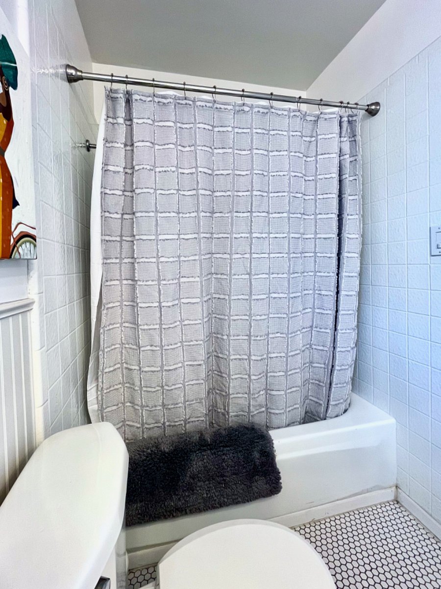 Hall bath with cast iron tub and shower