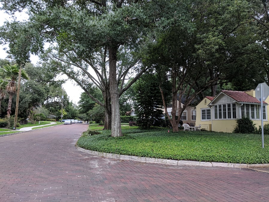 wide cobble stone streets. Front of the house and neighborhood.