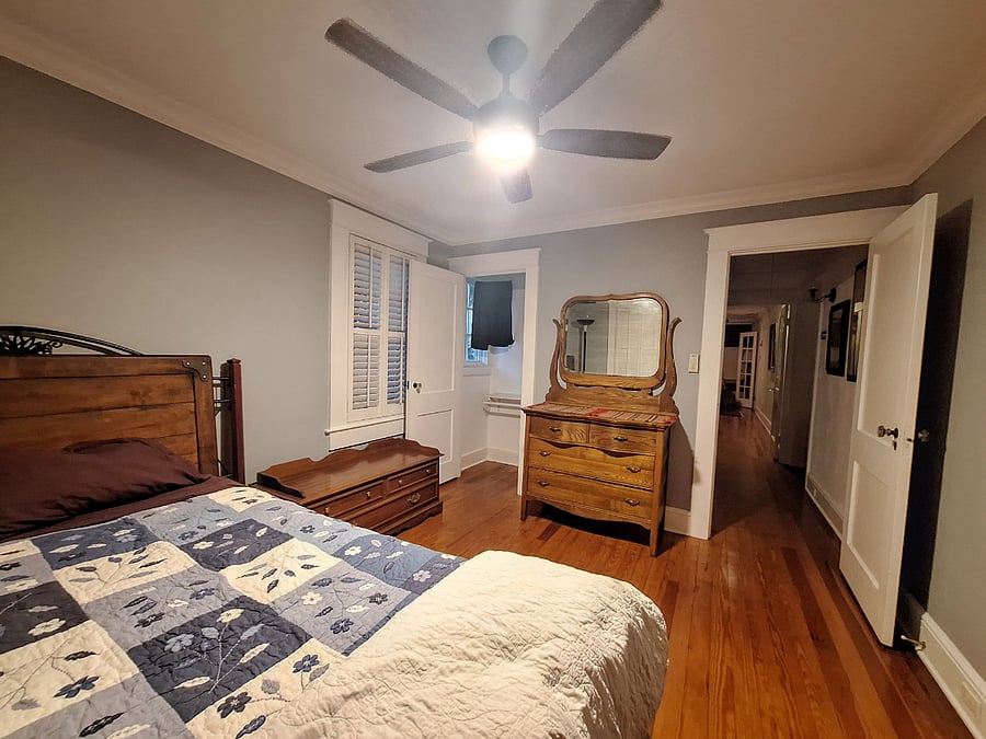 Front Bedroom showing bed, closet and hallway