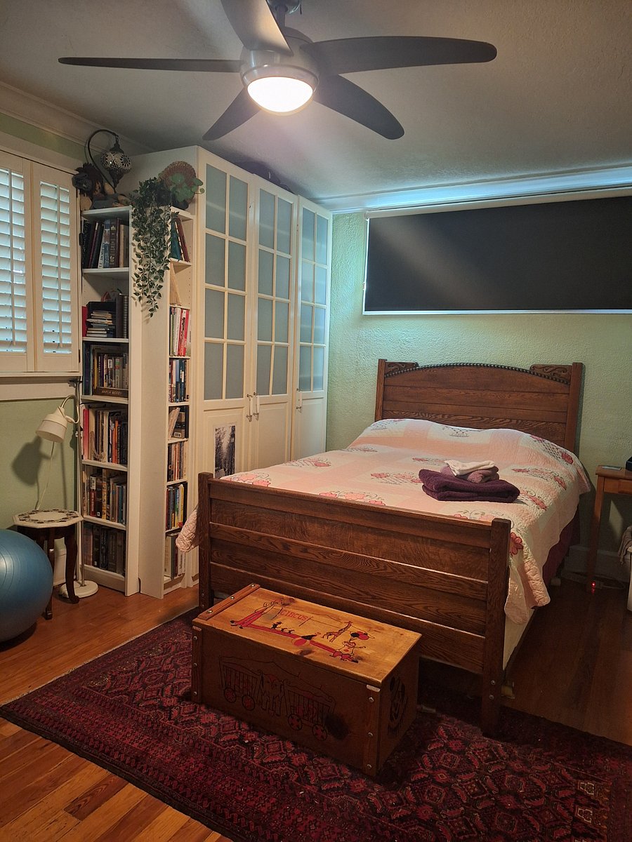 Master Bedroom showing bed and armoire.
