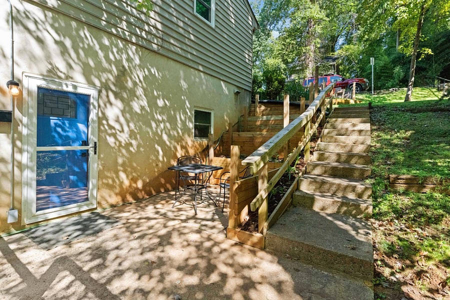 Follow the concrete steps down to your private side entrance!