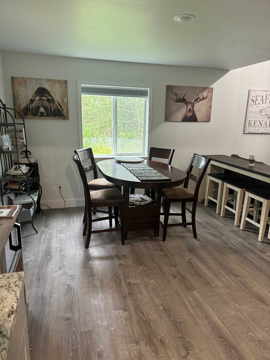 Dining area with 4 chairs and 3 stools
