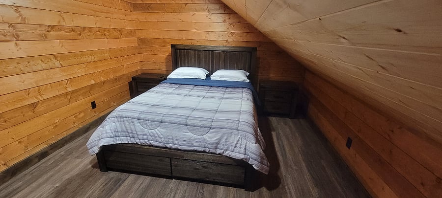 Queen bed with storage drawers.