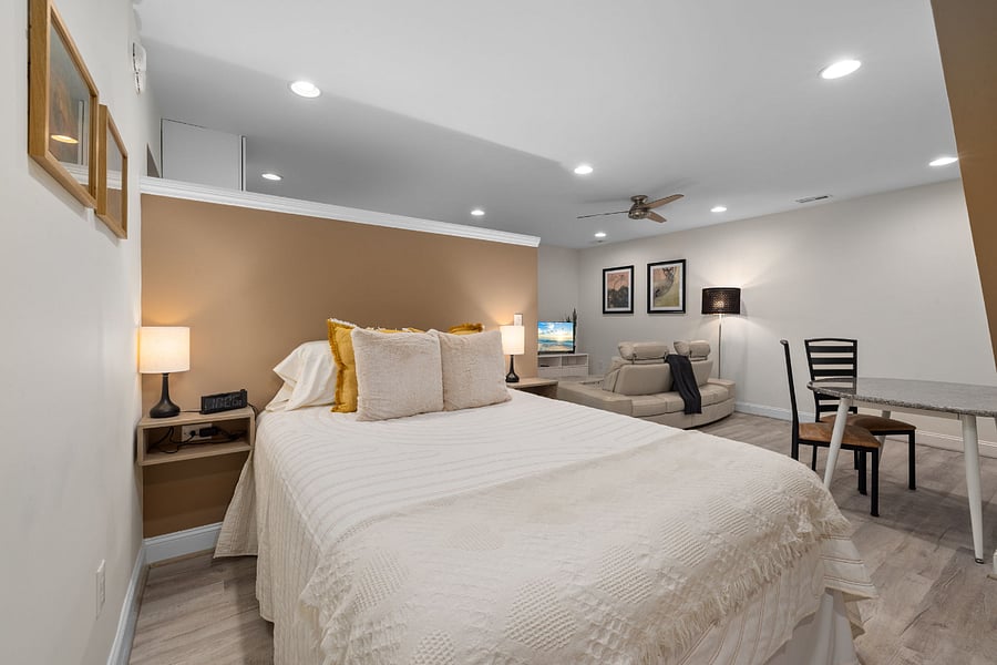 Queen bed with wired end tables for easy charging.