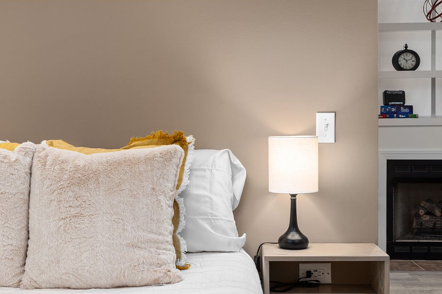 Wired end tables on each side of the bed for easy charging
