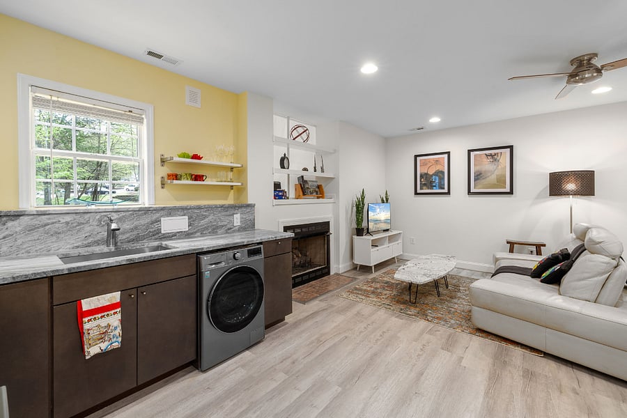 Kitchenette with window above the sink, and clothes washer/dryer combo unit